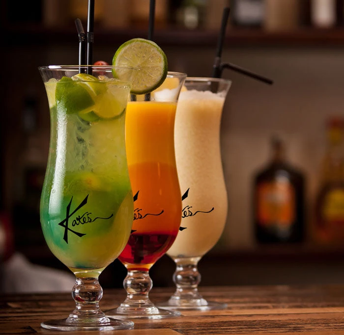 customized-hurricane-glasses-on-bar-1.jpg BarProducts.com PRODUCT DESIGNER 15oz Custom BarConic® Hurricane Glass